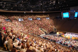 Mormon women sing in Marriott Center at BYU Women's Conference